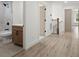 Hallway features a bathroom with shower and vanity on left and hallway leading away to right at 32 Wadley Nw St, Atlanta, GA 30314