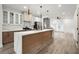 Modern kitchen with quartz countertops, large island, stainless steel appliances, and ample cabinets at 32 Wadley Nw St, Atlanta, GA 30314