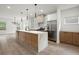 Spacious kitchen with an island, sleek countertops, stainless steel refrigerator, and open layout at 32 Wadley Nw St, Atlanta, GA 30314