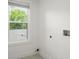 Bright laundry room with window and natural light, and washing machine hookups at 32 Wadley Nw St, Atlanta, GA 30314