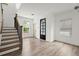 Inviting living room showcasing staircase, modern flooring, and windows with natural light at 32 Wadley Nw St, Atlanta, GA 30314