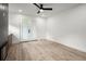 Bright room with modern flooring, fireplace, and white french doors to the outdoor space at 32 Wadley Nw St, Atlanta, GA 30314