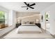Serene bedroom with decorative wall feature, stylish furnishings, and a bright window seat at 32 Wadley Nw St, Atlanta, GA 30314