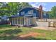 View of backyard showcasing the home's structure, patio area, and landscaping at 4593 Bexley Way, Stone Mountain, GA 30083