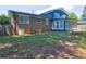 Backyard of a two-story home with a brick foundation and large sunroom at 4593 Bexley Way, Stone Mountain, GA 30083