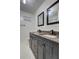 Elegant bathroom featuring a double sink vanity with modern fixtures and hexagon tile flooring at 4593 Bexley Way, Stone Mountain, GA 30083