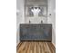 Bathroom featuring a double vanity, framed mirrors, and modern fixtures at 4593 Bexley Way, Stone Mountain, GA 30083