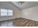Spacious bedroom featuring vaulted ceilings, new flooring, and large windows at 4593 Bexley Way, Stone Mountain, GA 30083