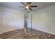Bedroom featuring a ceiling fan, closet, and a doorway at 4593 Bexley Way, Stone Mountain, GA 30083