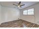 Cozy bedroom featuring a ceiling fan and natural light from a window at 4593 Bexley Way, Stone Mountain, GA 30083
