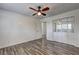 Bedroom featuring ceiling fan, a closet with mirrored doors, and a doorway at 4593 Bexley Way, Stone Mountain, GA 30083