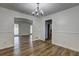 Bright dining room with hardwood floors and modern chandelier at 4593 Bexley Way, Stone Mountain, GA 30083