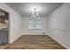 Bright dining room with hardwood floors and modern chandelier at 4593 Bexley Way, Stone Mountain, GA 30083