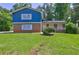 Charming two-story home with brick accents and lush green lawn at 4593 Bexley Way, Stone Mountain, GA 30083