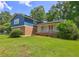 Charming two-story home with brick accents and lush green lawn at 4593 Bexley Way, Stone Mountain, GA 30083