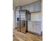 Modern kitchen featuring stainless steel refrigerator and gray cabinets at 4593 Bexley Way, Stone Mountain, GA 30083