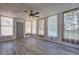 Bright sunroom with wood-look floors and plenty of windows providing natural light at 4593 Bexley Way, Stone Mountain, GA 30083