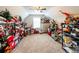 Attic space for storage, with carpeting, featuring shelving units and seasonal decorations at 98 Heritage Pointe Dr, Villa Rica, GA 30180