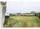 Spacious backyard featuring a well-maintained lawn with dark wood fencing at 98 Heritage Pointe Dr, Villa Rica, GA 30180