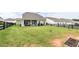 Expansive backyard with a covered patio and dark fencing, perfect for outdoor activities at 98 Heritage Pointe Dr, Villa Rica, GA 30180