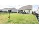 Backyard featuring a large lawn with fencing, ideal for relaxation and recreation at 98 Heritage Pointe Dr, Villa Rica, GA 30180