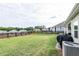 Lush green backyard with a black fence, AC unit, and ample space at 98 Heritage Pointe Dr, Villa Rica, GA 30180