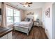 Charming bedroom with wood floors, large window, and stylish decor at 98 Heritage Pointe Dr, Villa Rica, GA 30180