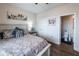 Cozy bedroom with views into bathroom featuring a patterned duvet and matching pillows at 98 Heritage Pointe Dr, Villa Rica, GA 30180