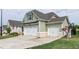 Side view of a lovely home with a three-car garage and well-maintained lawn and landscaping at 98 Heritage Pointe Dr, Villa Rica, GA 30180