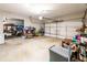 Spacious and well-lit garage with ample storage space and golf cart at 98 Heritage Pointe Dr, Villa Rica, GA 30180