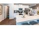 A modern kitchen features an open pantry, stainless steel appliances, white cabinets, and a large island at 98 Heritage Pointe Dr, Villa Rica, GA 30180