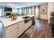 A modern kitchen with a large sink, stainless steel appliances, and an island with bar seating at 98 Heritage Pointe Dr, Villa Rica, GA 30180