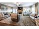 Comfortable living room with a fireplace and ample natural light from large windows at 98 Heritage Pointe Dr, Villa Rica, GA 30180