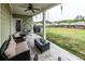 Relaxing covered patio features comfortable seating and an open view of the backyard at 98 Heritage Pointe Dr, Villa Rica, GA 30180