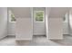 Bright attic room with natural light from two windows and neutral carpet at 2055 Timberland Dr, Cumming, GA 30040