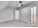 Finished attic room featuring carpeting, ceiling fan and white trim at 2055 Timberland Dr, Cumming, GA 30040