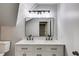 Modern bathroom with double sink vanity, marble countertop, and sleek black fixtures at 2055 Timberland Dr, Cumming, GA 30040
