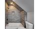 Tiled shower with built-in niche over a tub in modern style bathroom at 2055 Timberland Dr, Cumming, GA 30040