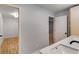View of the bathroom vanity, with an open door to an adjacent bedroom at 2055 Timberland Dr, Cumming, GA 30040