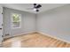 Bedroom featuring hardwood floors, a ceiling fan, and a double door closet at 2055 Timberland Dr, Cumming, GA 30040