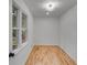 Small bedroom with hardwood floors, natural light and a modern chandelier at 2055 Timberland Dr, Cumming, GA 30040