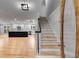 Inviting foyer featuring hardwood floors and a staircase, flowing into an open-concept space at 2055 Timberland Dr, Cumming, GA 30040