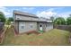 View of the house exterior and backyard showcasing a well maintained lawn and privacy fence at 2431 Kingston Heath Way, Marietta, GA 30008