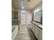 Modern bathroom with double sinks, a soaking tub, and a separate glass-enclosed shower at 2431 Kingston Heath Way, Marietta, GA 30008