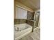 Bright bathroom featuring a soaking tub and a glass-enclosed shower at 2431 Kingston Heath Way, Marietta, GA 30008