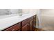 Bathroom vanity featuring a modern sink, white countertop, and dark cabinets at 2431 Kingston Heath Way, Marietta, GA 30008