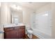 Well-lit bathroom with a shower-tub combo and a stylish vanity provides everyday comfort at 2431 Kingston Heath Way, Marietta, GA 30008