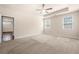 Spacious bedroom with a tray ceiling, carpet, and natural light from the double windows at 2431 Kingston Heath Way, Marietta, GA 30008