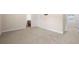 Large bedroom with neutral colors and carpet and a doorway leading to the bathroom at 2431 Kingston Heath Way, Marietta, GA 30008
