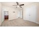 Bright bedroom with a ceiling fan and neutral carpeting offers a peaceful retreat at 2431 Kingston Heath Way, Marietta, GA 30008